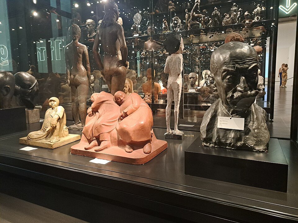 Sculptures in a glass case in the open depot