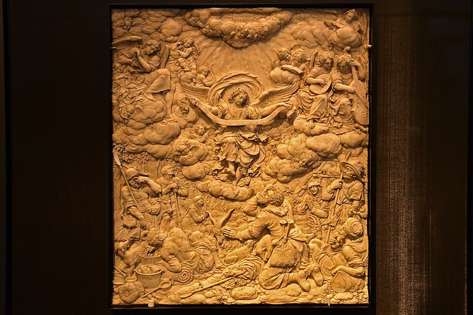 A carved relief of the shepherds' annunciation