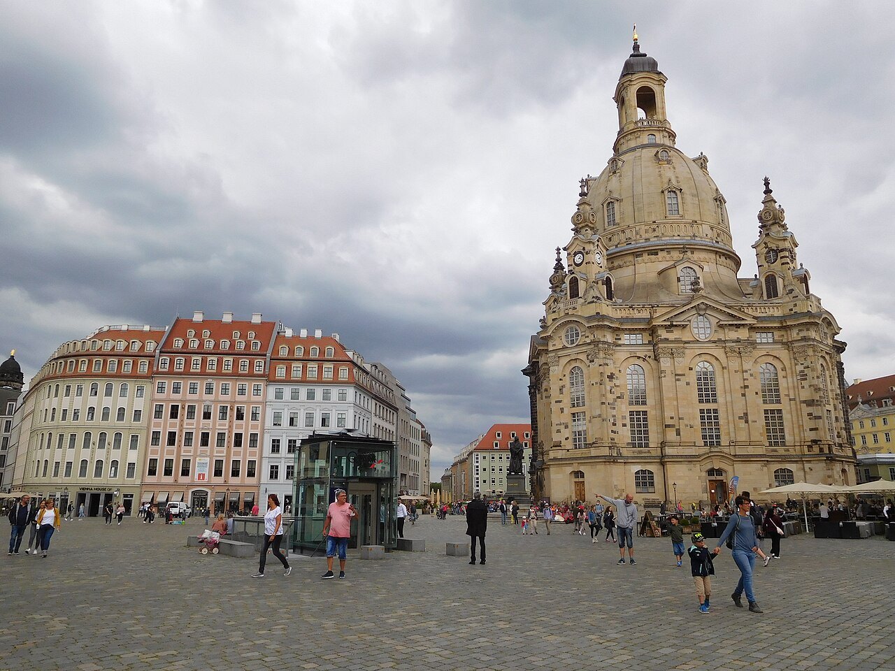 The church's patchwork walls from the square