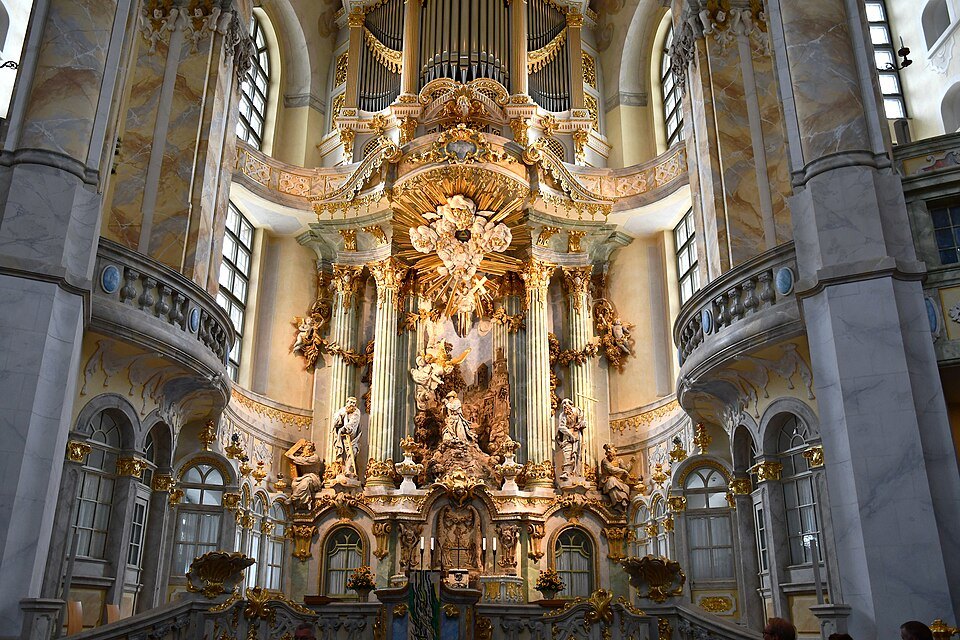The gilded altar with the organ above it