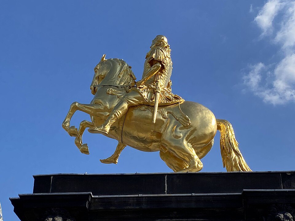 The gilded horse and rider in profile