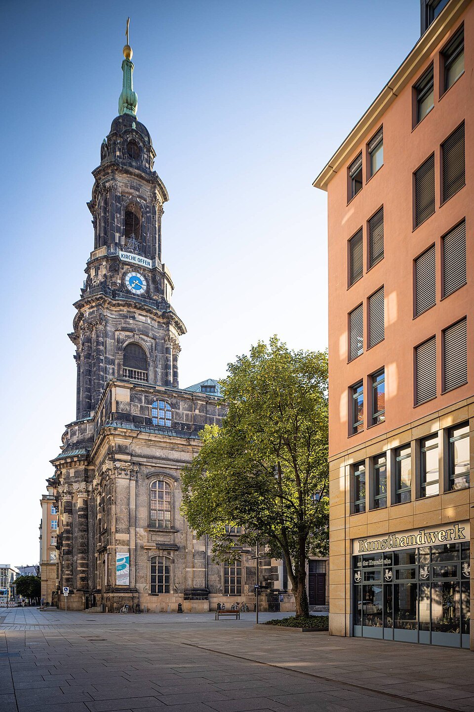The Kreuzkirche tower between modern buildings