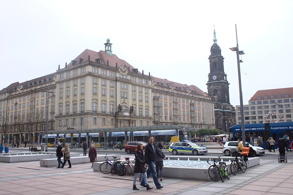 Trams and walkers on the Altmarkt's southeast corner