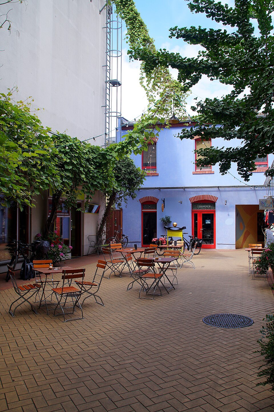 A quiet courtyard with café tables
