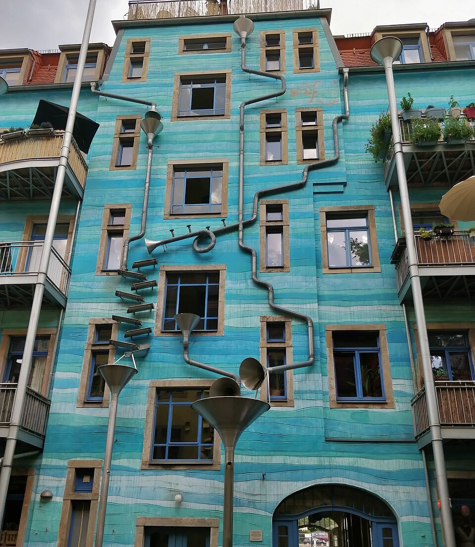The blue drainpipe wall in full view