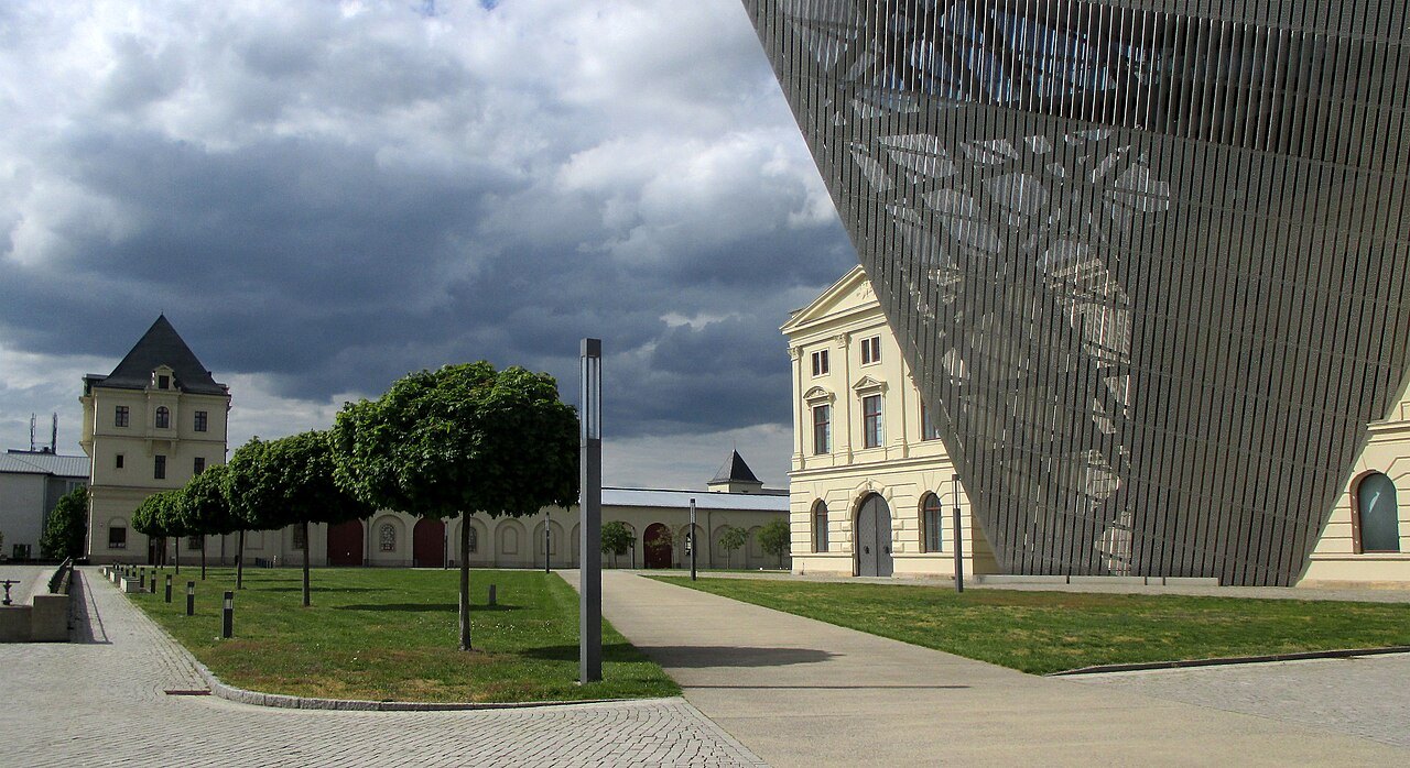 The steel wedge's shadow over the museum grounds