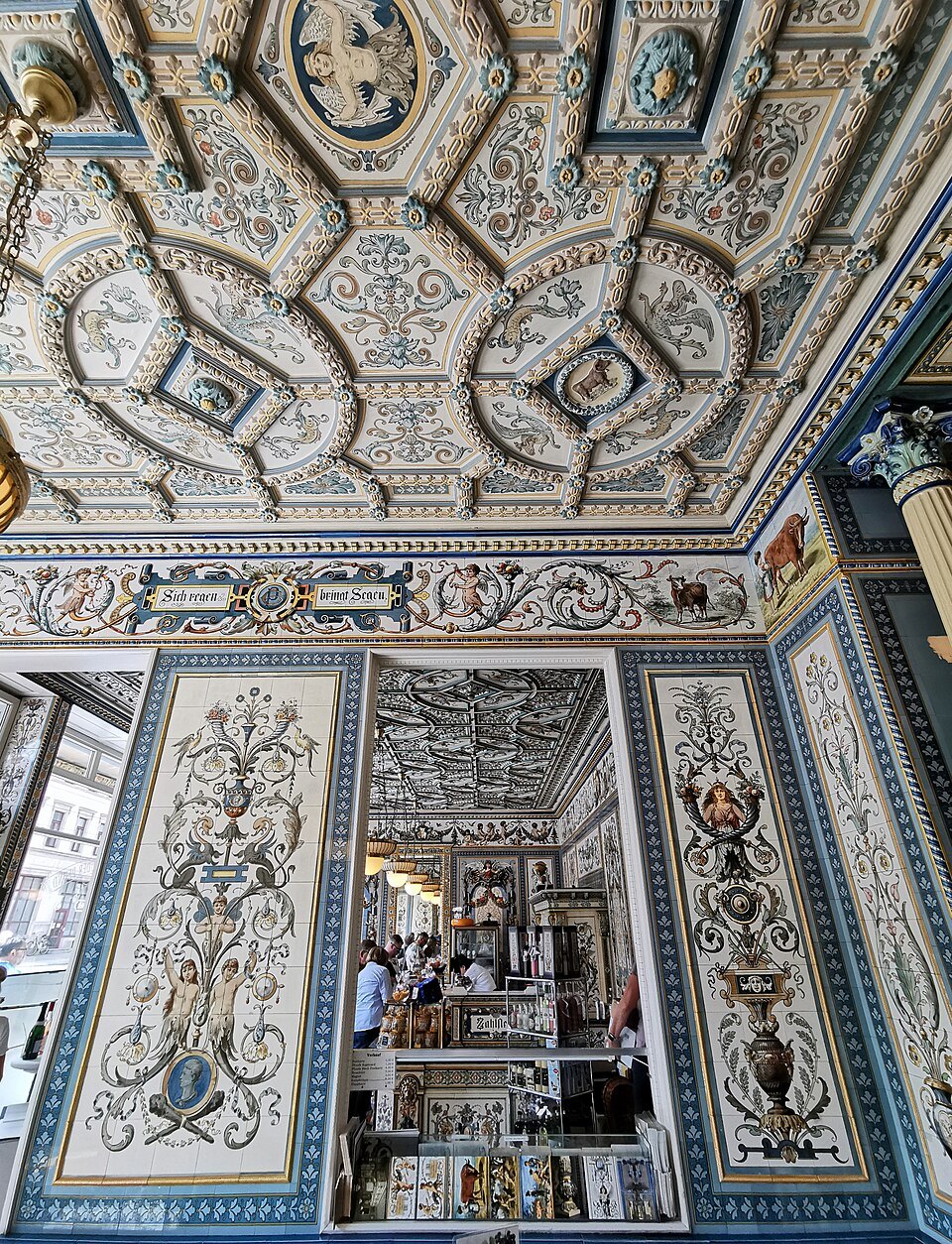 The painted tile ceiling above the salesroom