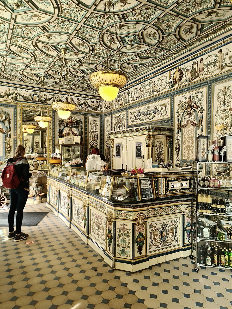 Shoppers at the tiled counter of Pfunds Molkerei