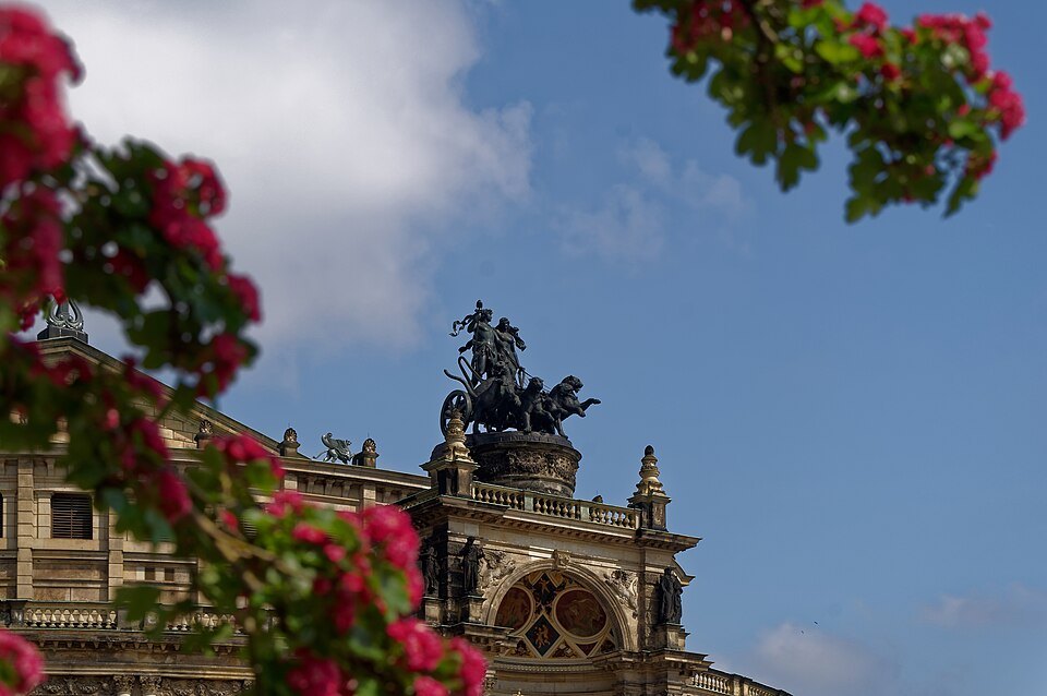 The opera roof sculpture through blossoms
